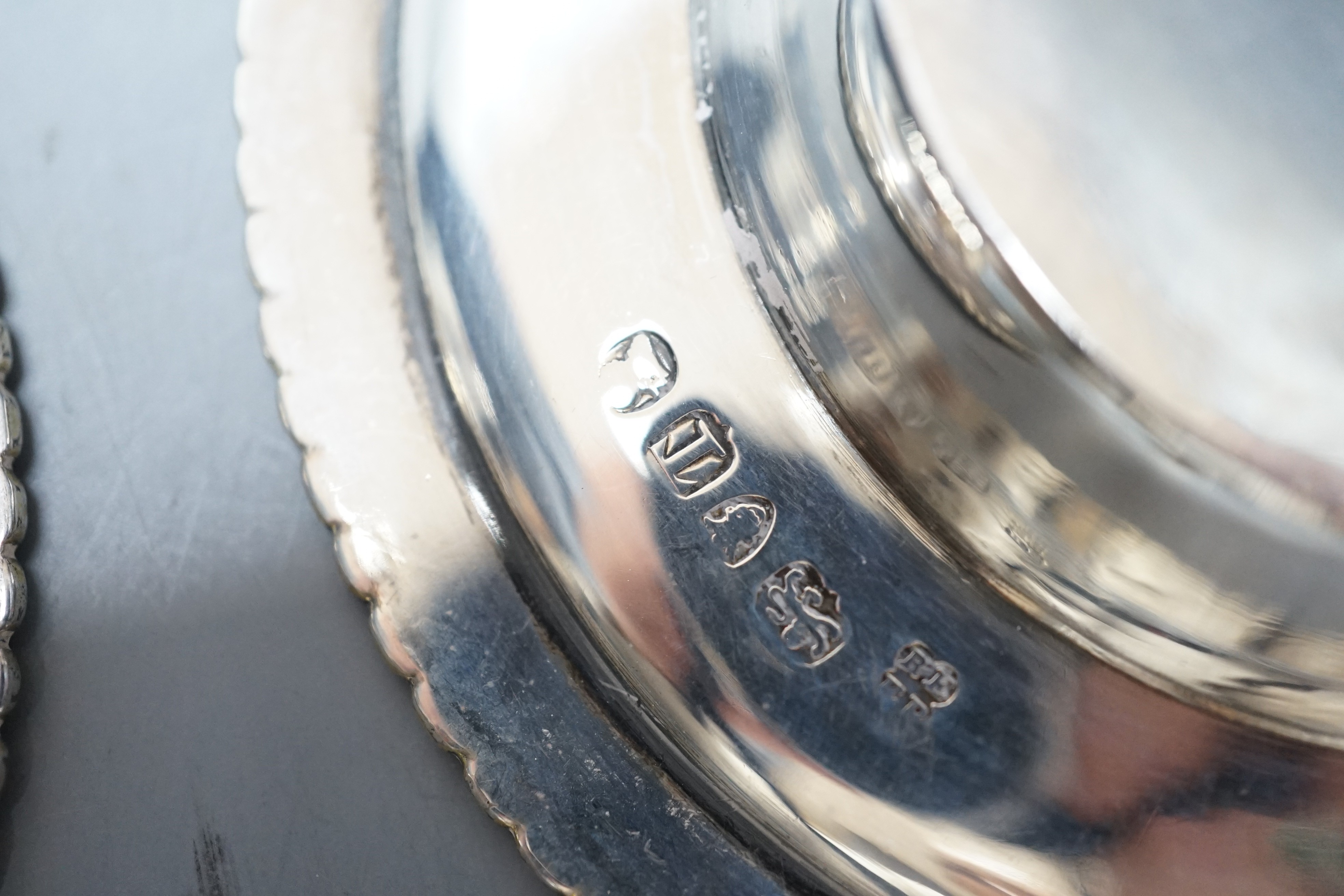 A pair of George III parcel gilt silver circular stands, with gadrooned borders, Emes & Barnard, London, 1814, 11cm, 5.4oz.